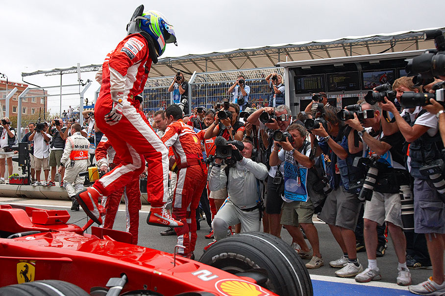 Polesetter Massa jumps from his Ferrari in parc ferme